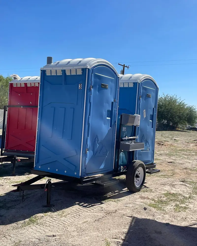 Porta potties loaded on a delivery trailer